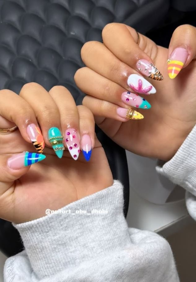 Hand-painted nail set in pastel blue, pink and gold
