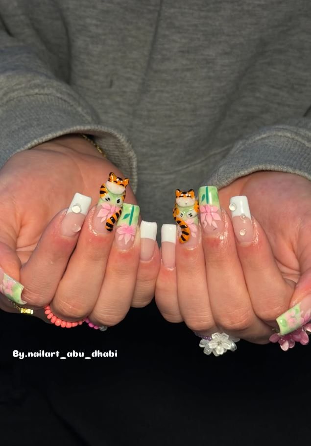 Square nails with green, pink and tiger-print art
