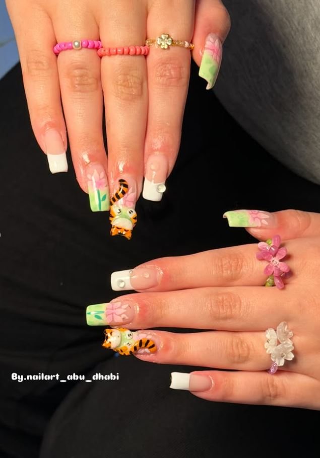 Nail set with 3D flowers and animal-print detail